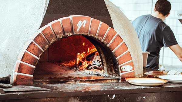 Wood-fired ovens under attack in the push for decarbonization